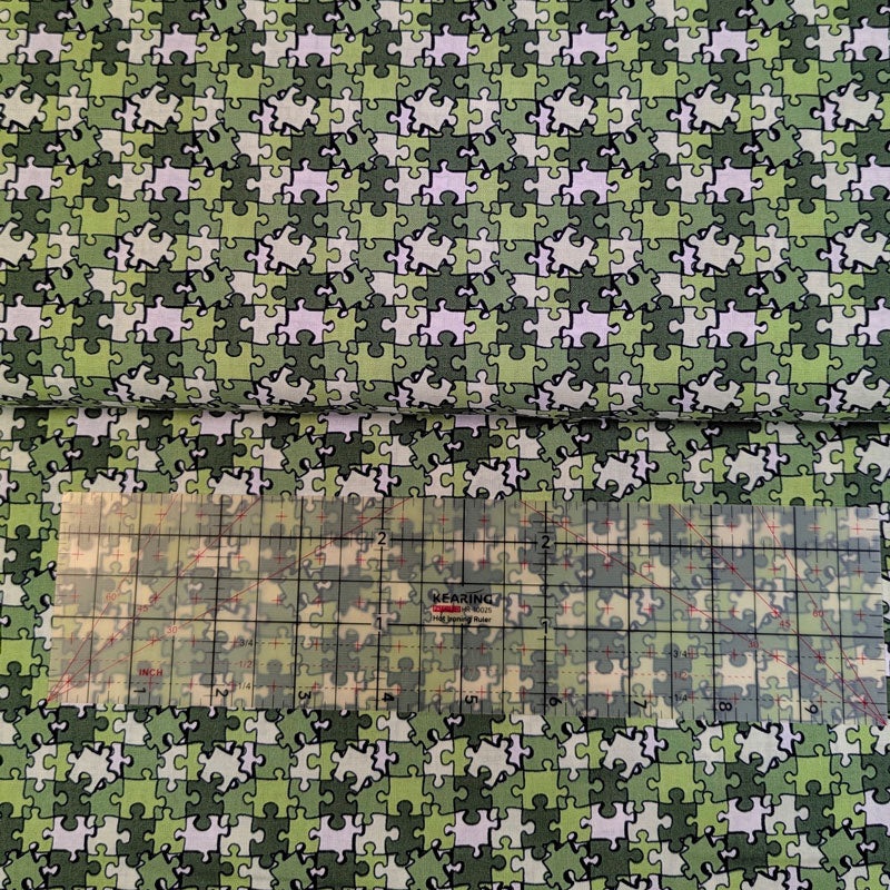 Quilting weight Cotton, khaki puzzle pieces, by the yard